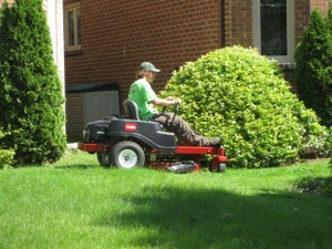 Chris Henry cutting grass in Thornhill on our new Toro mower